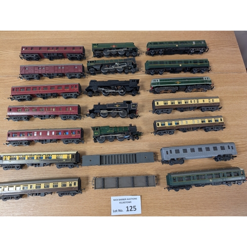 125 - Trains: 2 boxes of assorted engines, carriages, trucks, buildings, and other accessories; conditions... 