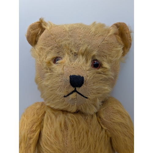 215 - Teddy Bears: Chiltern Hugmee 1940s-50s golden mohair teddy bear, with glass amber and black eyes, ve... 