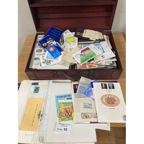 92 - Stamps: Case with hundreds of stamps on cards, packets and album pages.