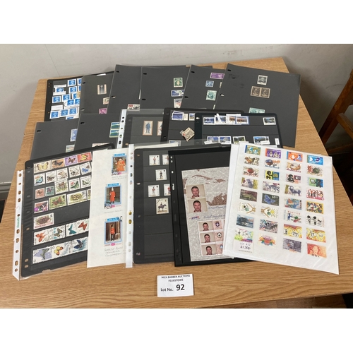 92 - Stamps: Case with hundreds of stamps on cards, packets and album pages.