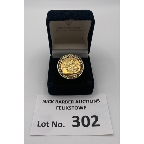 302 - Coins: 1911 Gold Sovereign within gold ring; Good condition.