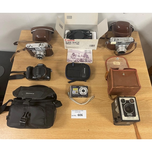 606 - Collectables: Cameras; various including boxed, older issues and more modern digital cameras.