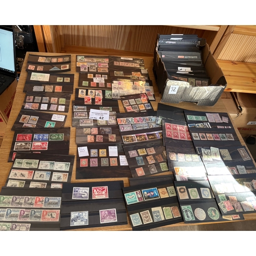 42 - Stamps : Random mix of collectable stamps on nearly 200 stock cards. Some old auction lots. Lots of ... 
