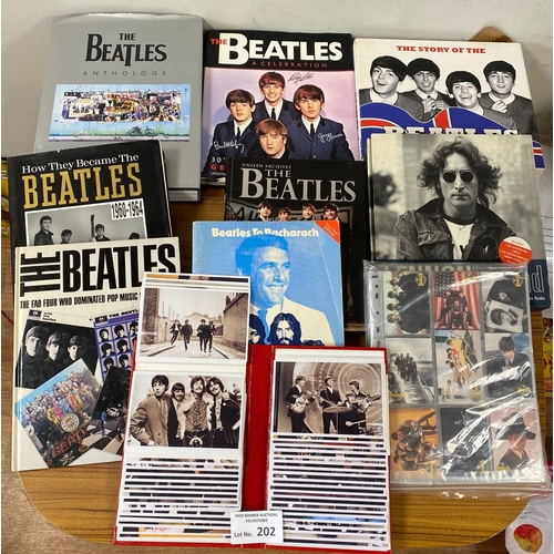202 - Records : A box of Beatles books, along with an album of repro photos/cards.