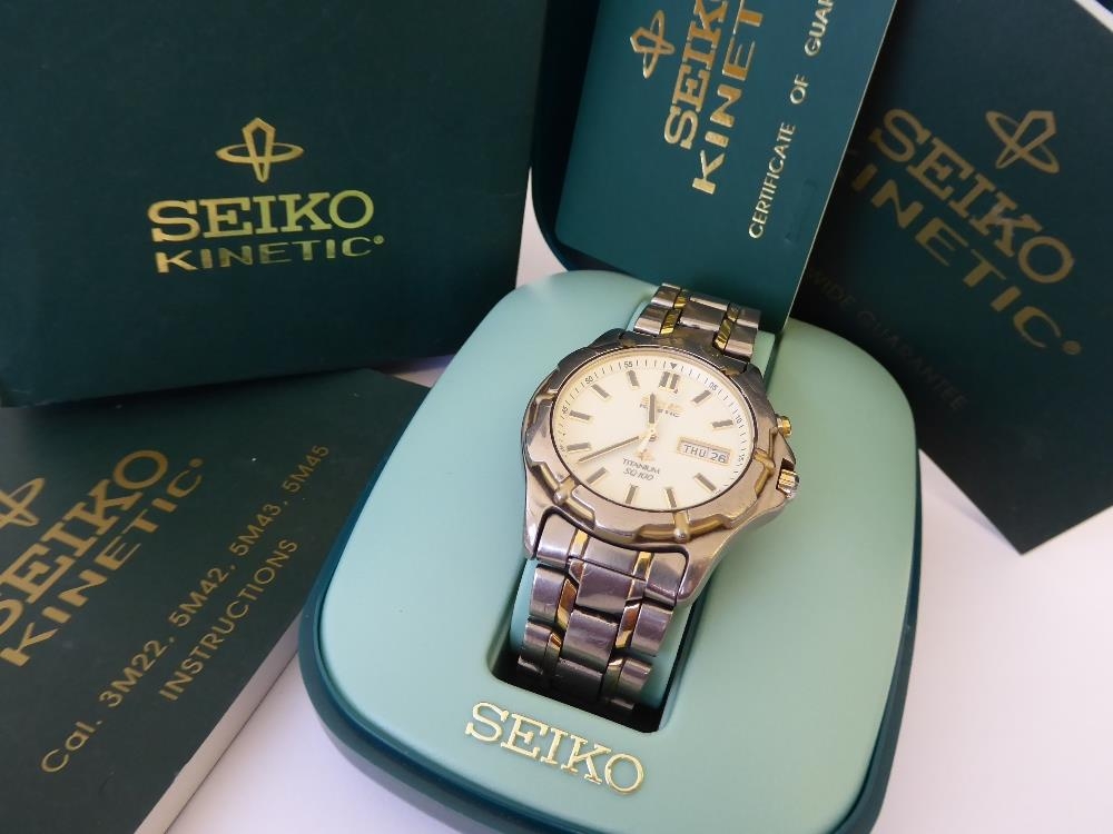 A Seiko Kinetic gents titanium strap watch, model 5M43-0C00, serial 6N1630,  with inner and outer box
