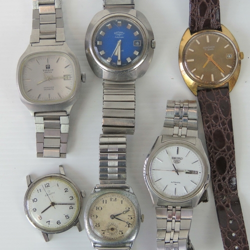 Six vintage mens wristwatches; Seiko 5 Automatic 7009-4040 with day date  aperture and original strap