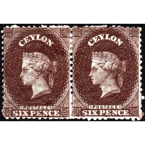 2158 - 1863-66 PERF. 12½ 6d SEPIA, a lightly mounted mint pair with re-entry. Fine. SG 55 £500.