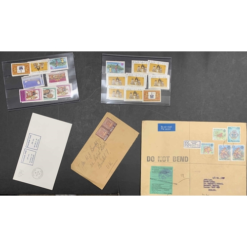 40 - WORLDWIDE ASSORTMENT: Small carton of envelopes, postcards, wrappers, and pre-paid envelopes/cards. ... 