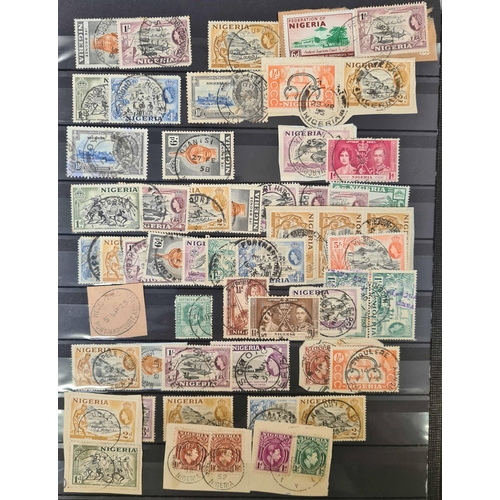 49 - ** BRITISH AFRICA CANCELLATIONS: Three stock books housing an accumulation of adhesives with much po... 