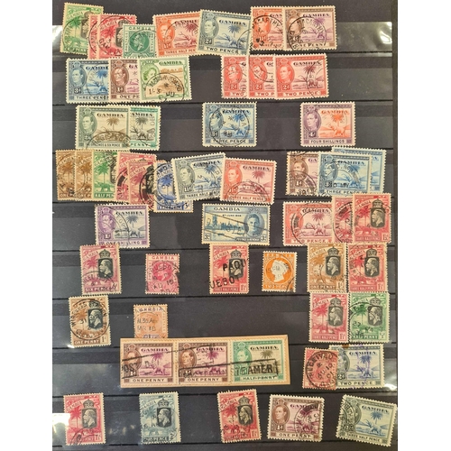 49 - ** BRITISH AFRICA CANCELLATIONS: Three stock books housing an accumulation of adhesives with much po... 