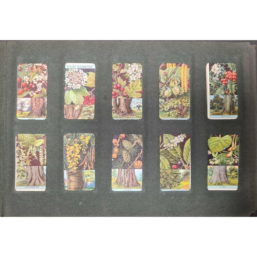 397 - APPARENTLY COMPLETE SETS OF CARDS: Three old cigarette card albums containing cards covering a wide ... 