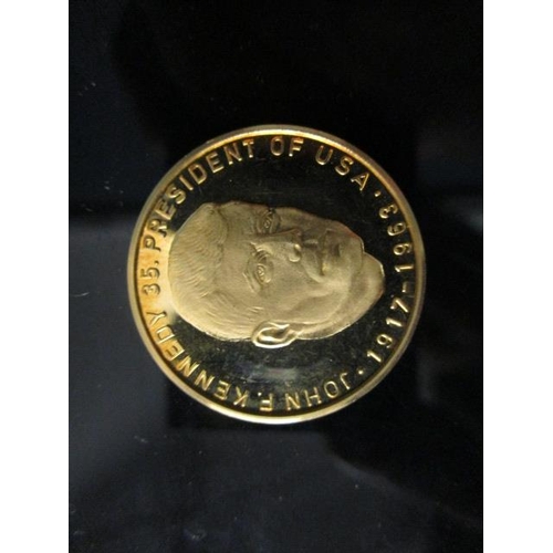 A German gold coin commemorating John F Kennedy 35 President of