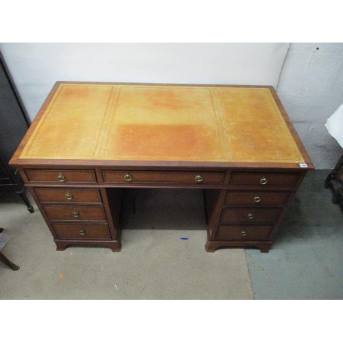 194 - A late Victorian ebony, string inlaid mahogany desk having a brown leather scriber over three in lin... 