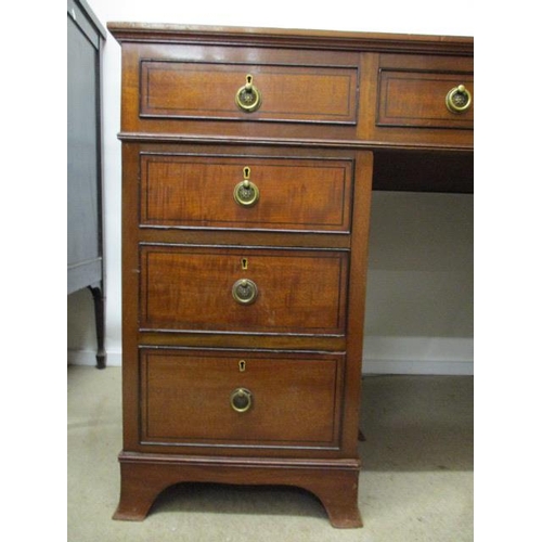 194 - A late Victorian ebony, string inlaid mahogany desk having a brown leather scriber over three in lin... 