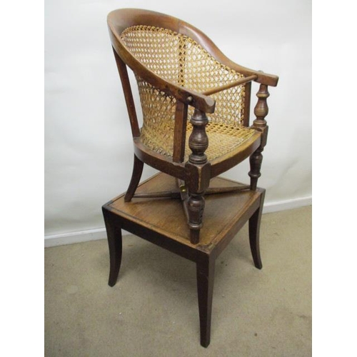 199 - A Victorian mahogany child's Berger style, curved back chair with a caned back and seat, raised on r... 