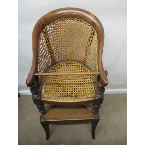 199 - A Victorian mahogany child's Berger style, curved back chair with a caned back and seat, raised on r... 