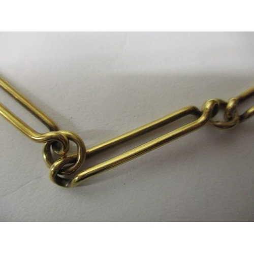 34 - A Victorian 18ct gold elongated loop and round link watch chain, 63g