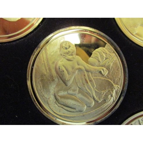 70 - Fifty silver gilt Franklin Mint 'Masterpieces 3 of Impressionism coins, in a mahogany case