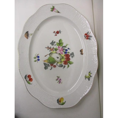 215 - A Herend porcelain oval meat plate decorated with fruit, vegetables and nuts with a blue back stamp