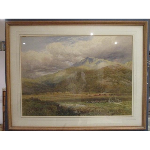 223 - Suttan Palmer - a highland scene with a figure in a field and hills beyond, watercolour, 21