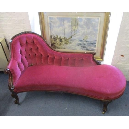 243 - A Victorian mahogany show wood framed chaise longue with carved, floral ornament, upholstered in pin... 