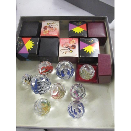 102 - A selection of Swarovski and other small commemorative paperweights