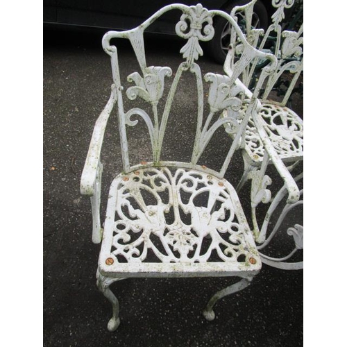 13 - A white painted cast metal garden table and four chairs, along with a smaller garden table and a gre... 