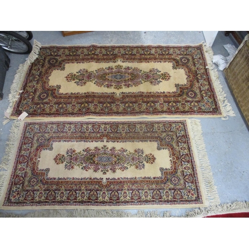 346 - Two Persian design, machine made rugs with medallions on a cream ground, the largest 68