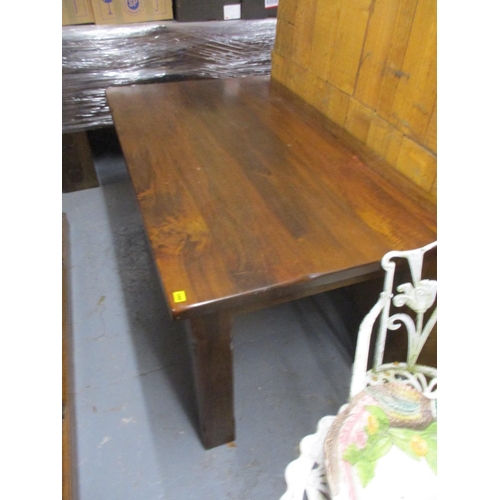 348 - A modern mango wood dining table, raised on square legs, 31