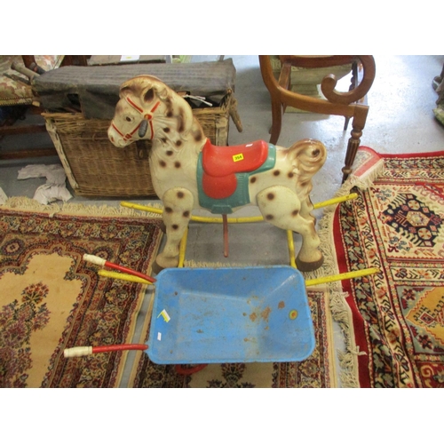 354 - A painted metal rocking horse and a Mobo toy wheelbarrow