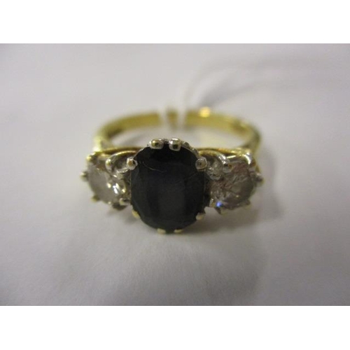 71 - A diamond and sapphire ring set in 18ct gold