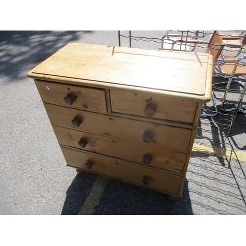 423 - An early 20th century pine five-drawer chest, raised on turned legs, 38