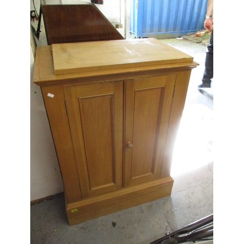 426 - A modern pine twin door cabinet on a plinth, 36