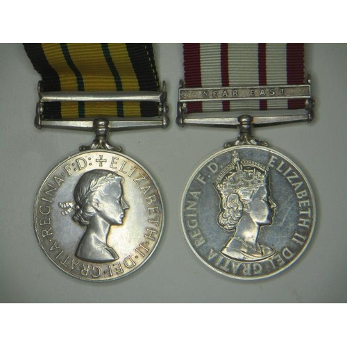 110 - Two Elizabeth II medals, an African General Service medal with a clasp, Kenya inscribed 23058591 FUS... 