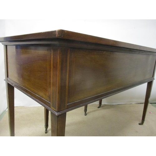 126 - A Victorian mahogany and marquetry desk having a drawer flanked by four drawers, with scrolled folia... 