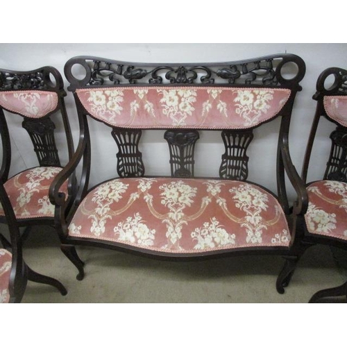 127 - A late Victorian mahogany framed, seven piece salon suite with scroll, carved and pierced ornament, ... 