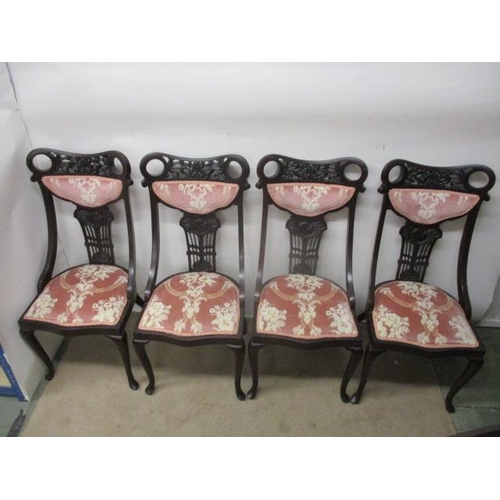 127 - A late Victorian mahogany framed, seven piece salon suite with scroll, carved and pierced ornament, ... 