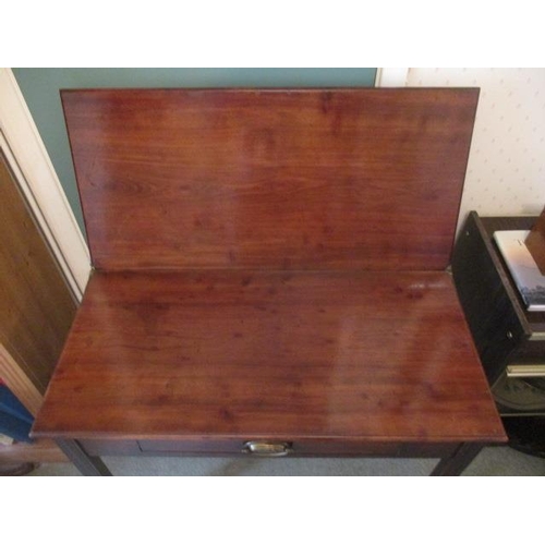 191 - WITHDRAWN  A George III mahogany tea table having a foldover top, over a frieze drawer, raised on sq... 