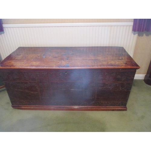 194 - WITHDRAWN  An 18th century continental boarded fruit wood chest having a hinged plank top, over a ca... 