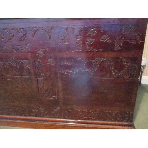 194 - WITHDRAWN  An 18th century continental boarded fruit wood chest having a hinged plank top, over a ca... 