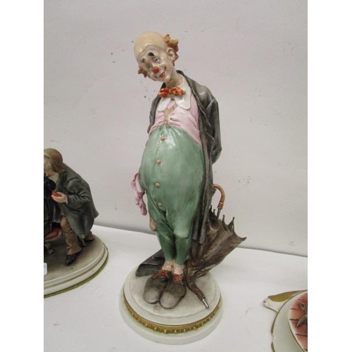 198 - A group of five Capodimonte porcelain figurines, three Galli figures to include a clown with an umbr... 