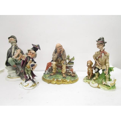 200 - A group of four Capodimonte porcelain figurines, two Galli figures to include a huntsman and his dog... 