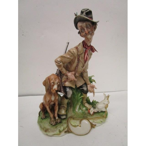 200 - A group of four Capodimonte porcelain figurines, two Galli figures to include a huntsman and his dog... 