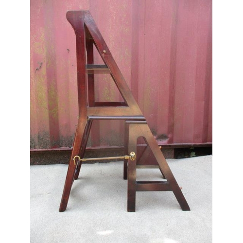 203 - A Victorian mahogany metamorphic chair/library steps having a crossover, splat back and a solid seat... 