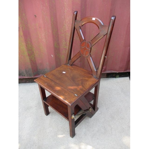 203 - A Victorian mahogany metamorphic chair/library steps having a crossover, splat back and a solid seat... 