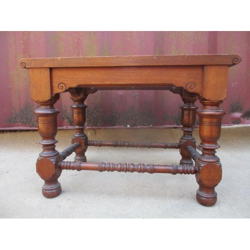 205 - A Victorian walnut luggage stand with a slatted top, raised on turned, block legs, united by stretch... 