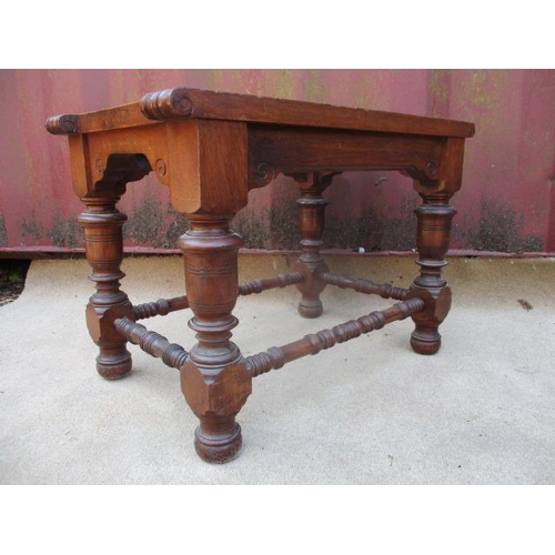 205 - A Victorian walnut luggage stand with a slatted top, raised on turned, block legs, united by stretch... 