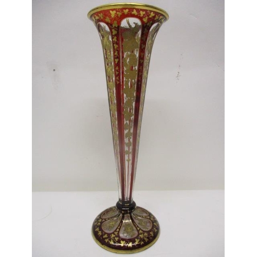 227 - A late 19th century Bohemian clear and overlaid red glass, hexagonal, trumpet shaped vase, on a dome... 