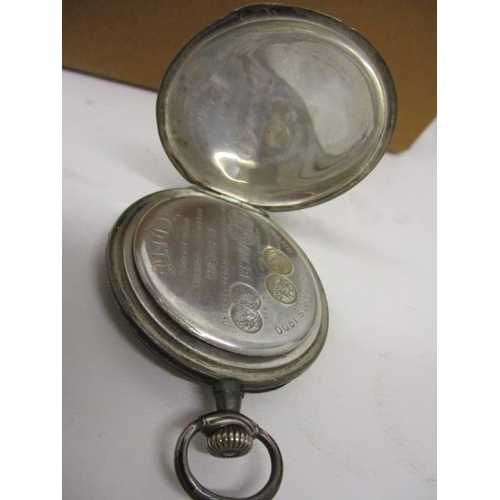 24 - An early 20th century Zenith, nickel cased pocket watch, the dust cover inscribed Grand Prix, Paris ... 