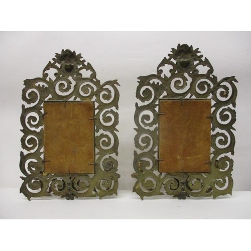 273 - A pair of late 19th century brass girandoles with a bevelled rectangular plate in a floral, scrolled... 